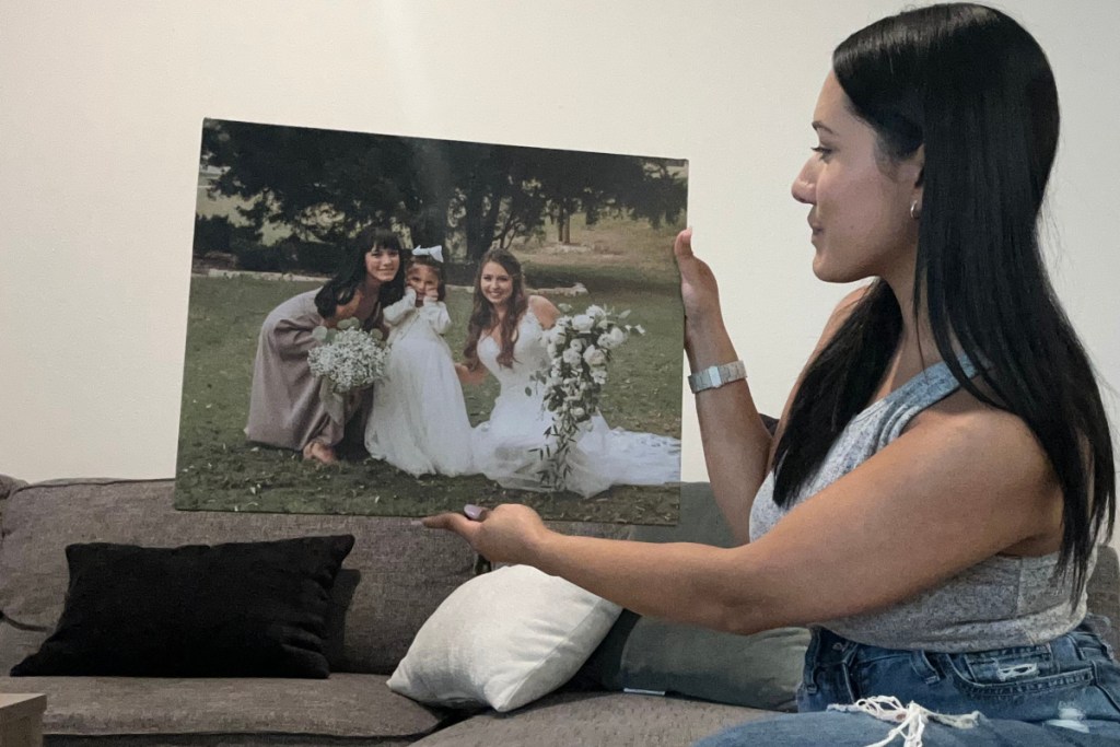 woman holding large canvas