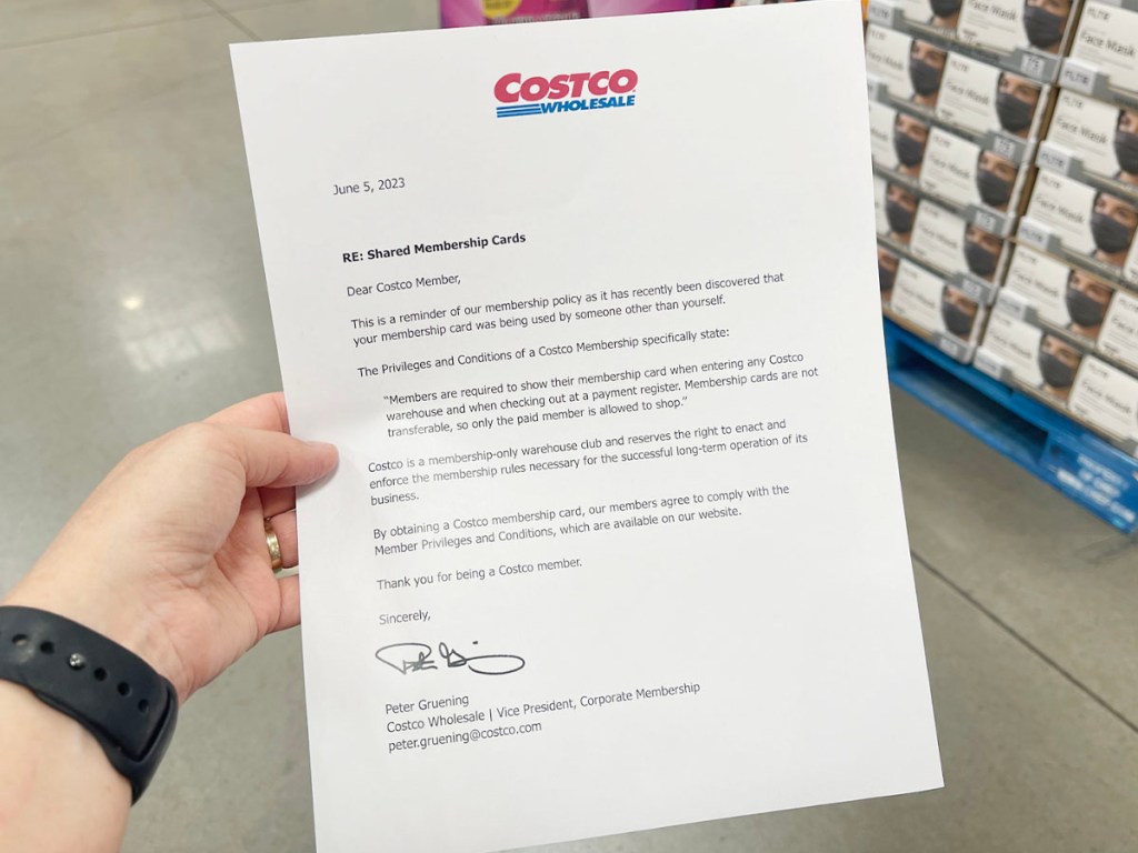 hand holding costco card sharing memo