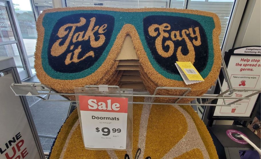 two doormats, sun glasses and lemon wedge