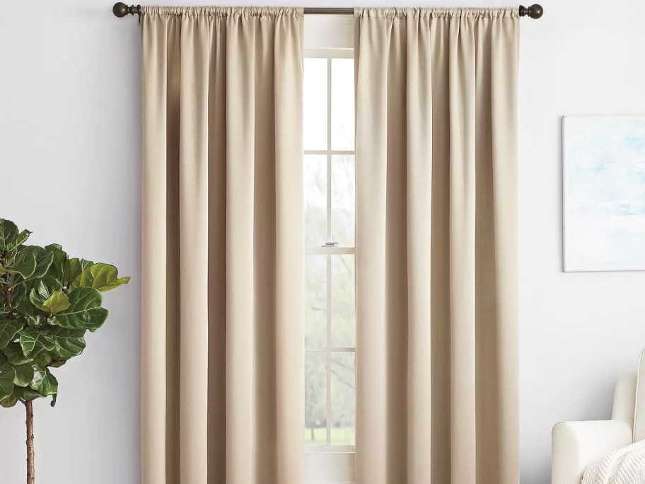 taupe blackout curtains over window