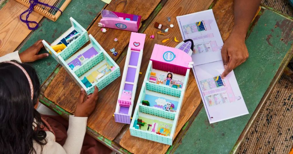 a mom and little girl playing with Lego gabbys dollhouse