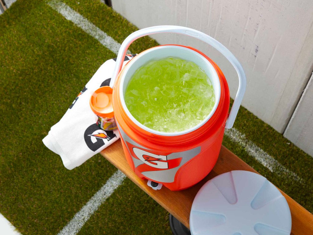 3 gallon gatorade cooler filled with gatorade on bench