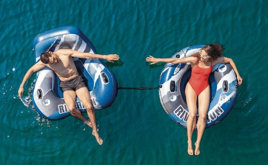 a woman in a swimsuit on a tube style pool float and a a man in a swimsuit on a tube style pool float