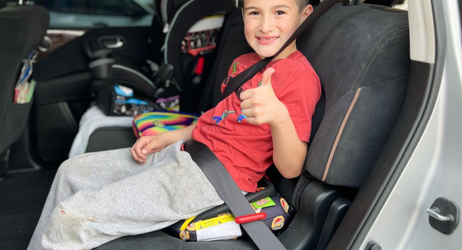 kid sitting on BubbleBum Inflatable Booster seats in the car