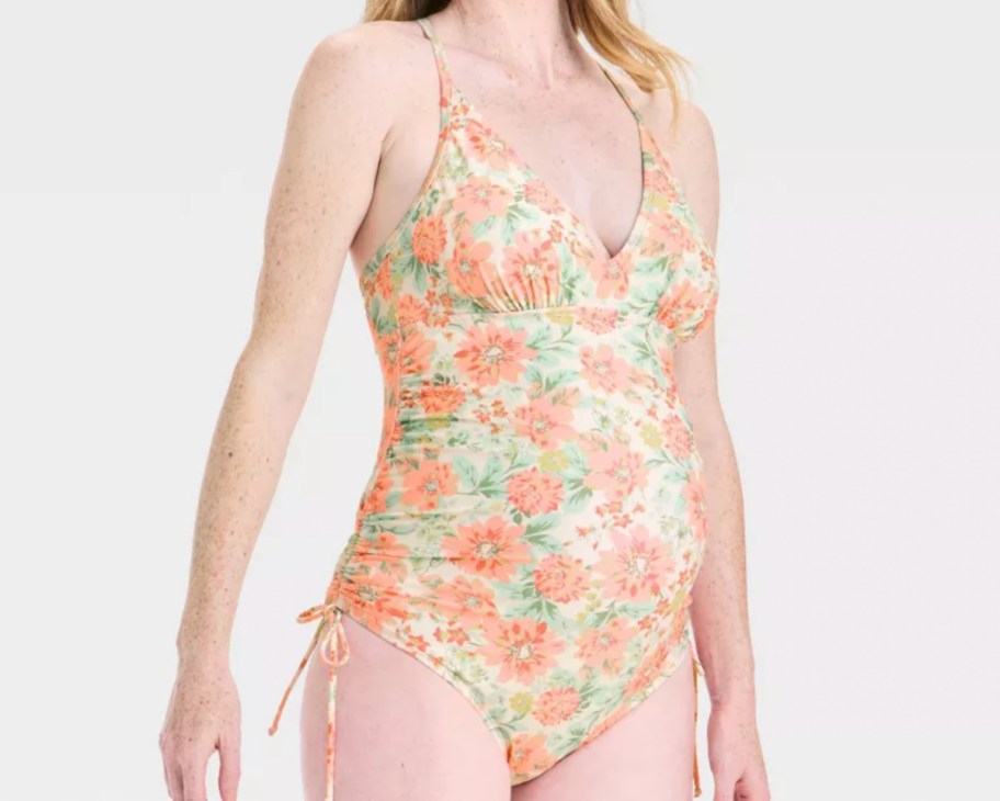 woman in pink and white floral maternity swim