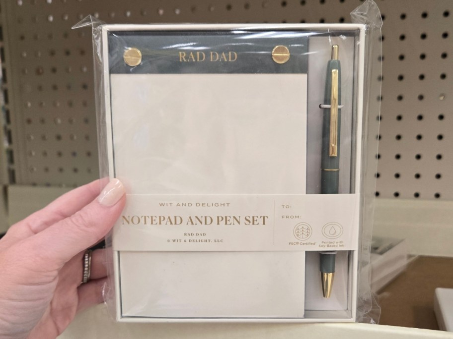 hand holding a rad dad notepad set