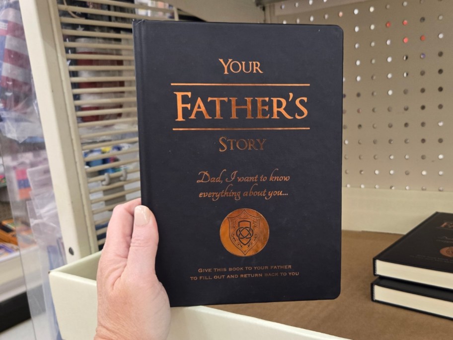 hand holing your father's store notebook