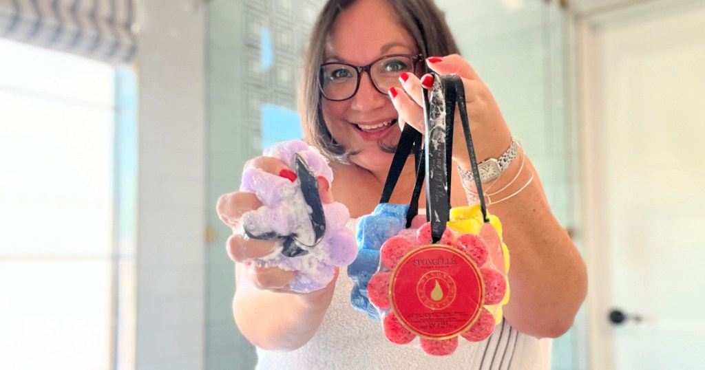 woman holding wildflower assortment pack of sponges