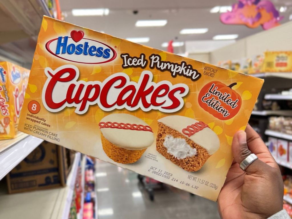 Hostess Iced Pumpkin Cupcakes 8 Count box in woman's hand at Target