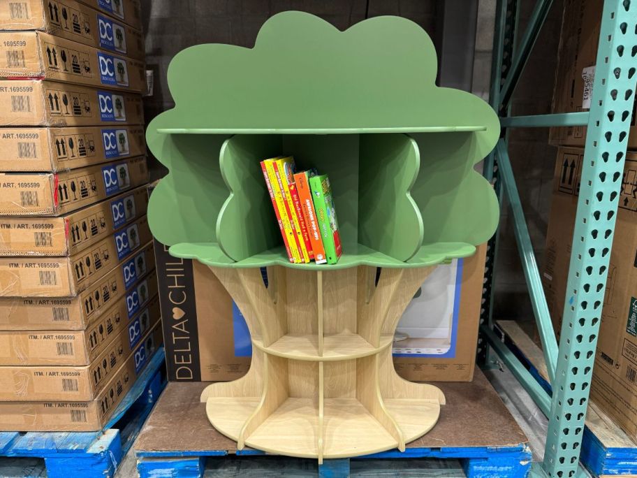 a kids bookshelf that looks like a tree sitting on store shelf