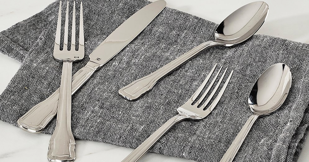 flatware set on top of a linen napkin