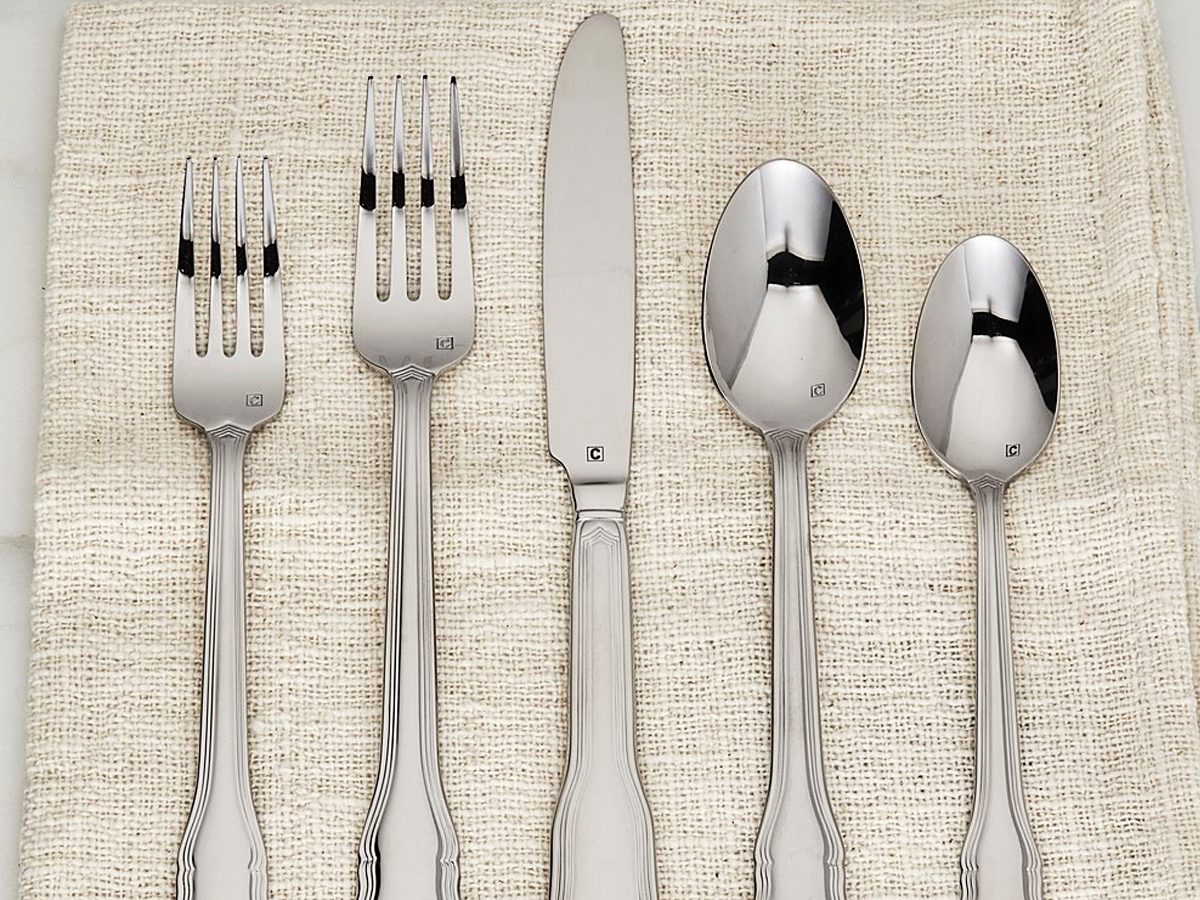 flatware set on top of a linen napkin