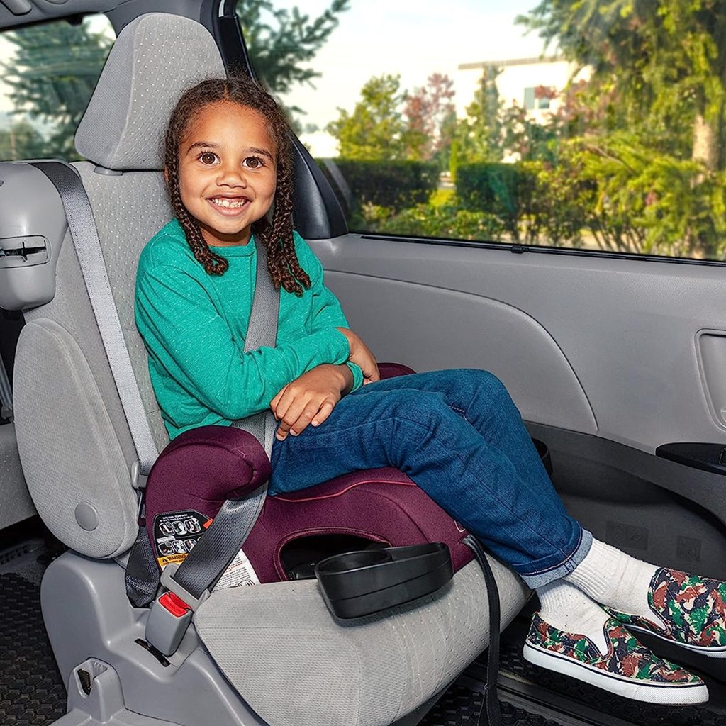 Girl sitting in a booster seat