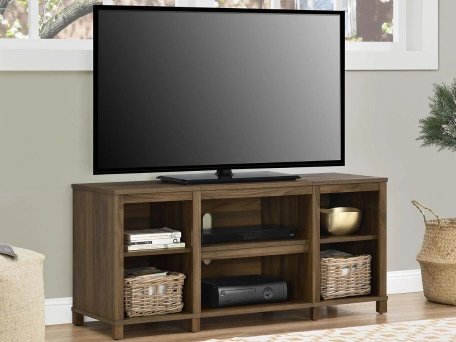 A Mainstays Parsons TV Stand for TVs up to 50" in Canyon Walnut 