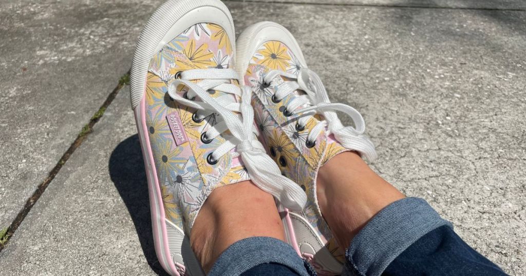 Woman's feet wearing Rocket Dog Floral Sneakers