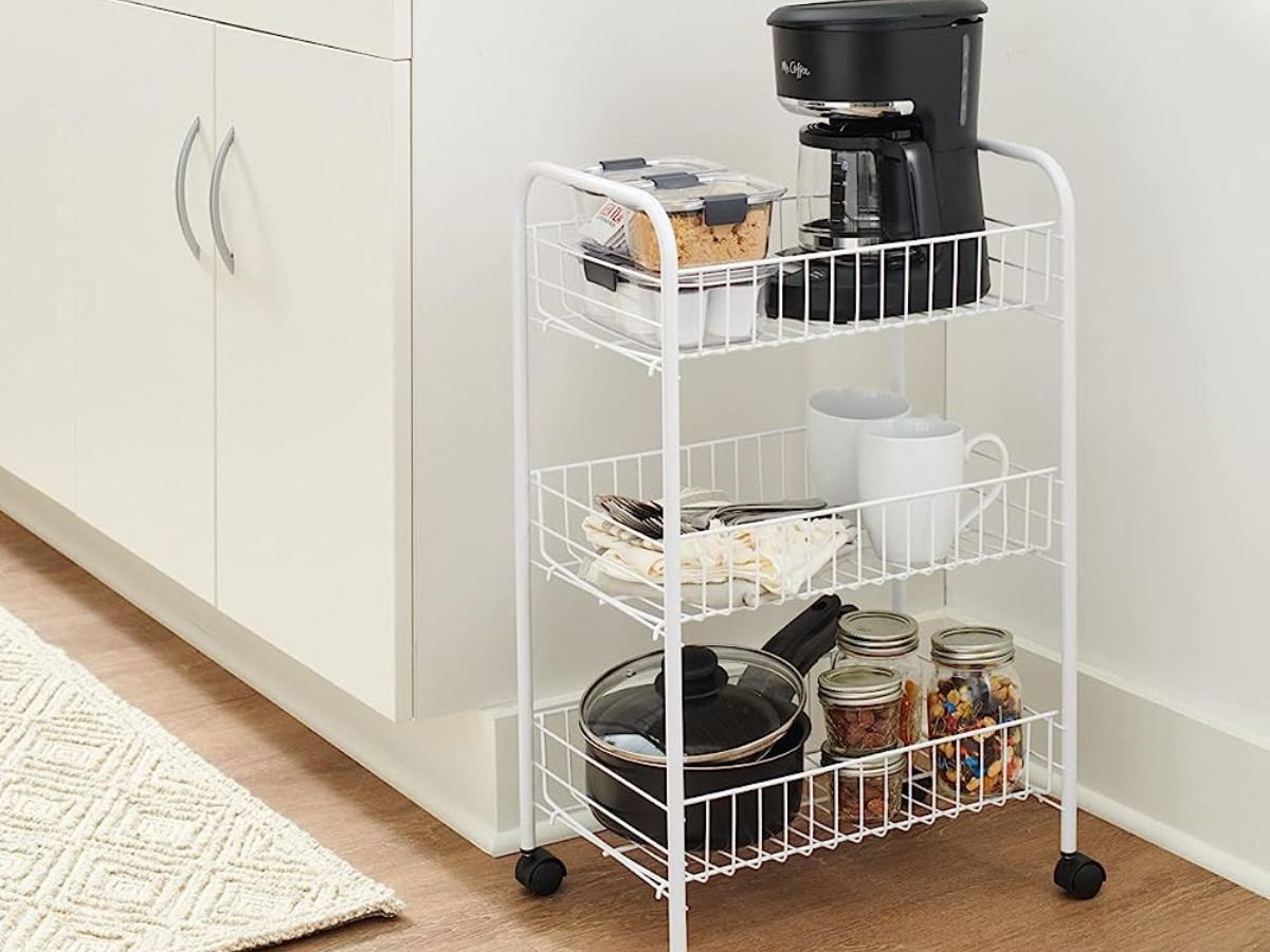 3-tier cart in kitchen with coffee maker, coffee cups, pans and jars in them