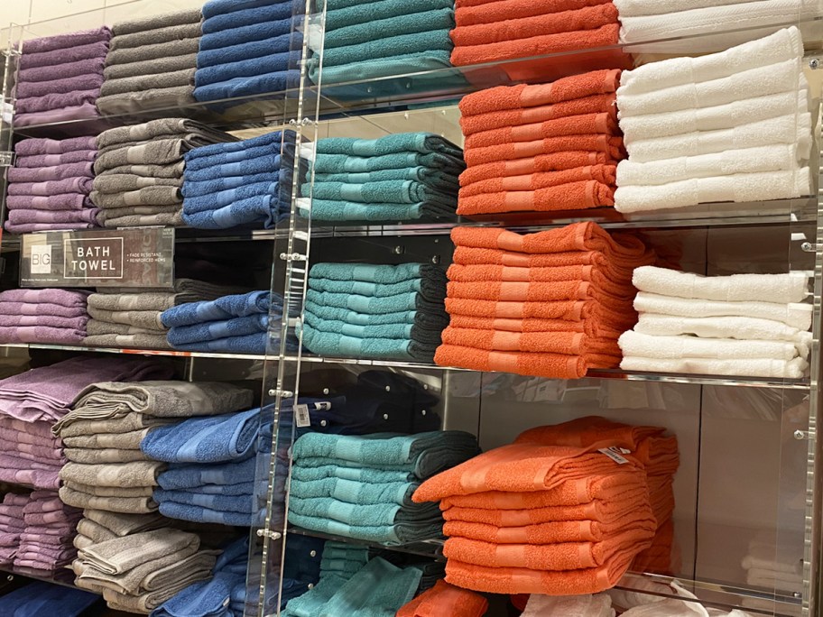 wall display of bath towels in store