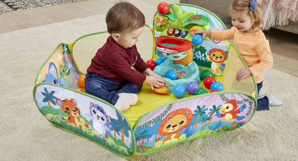 A child playing in a ball pit with a friend