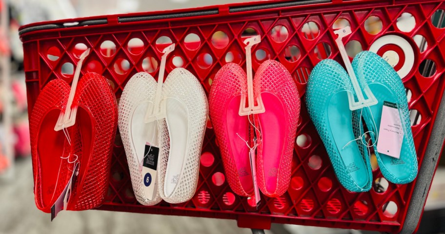 4 pairs of Wild Fable Jelly Shoes hanging from a Target shopping cart