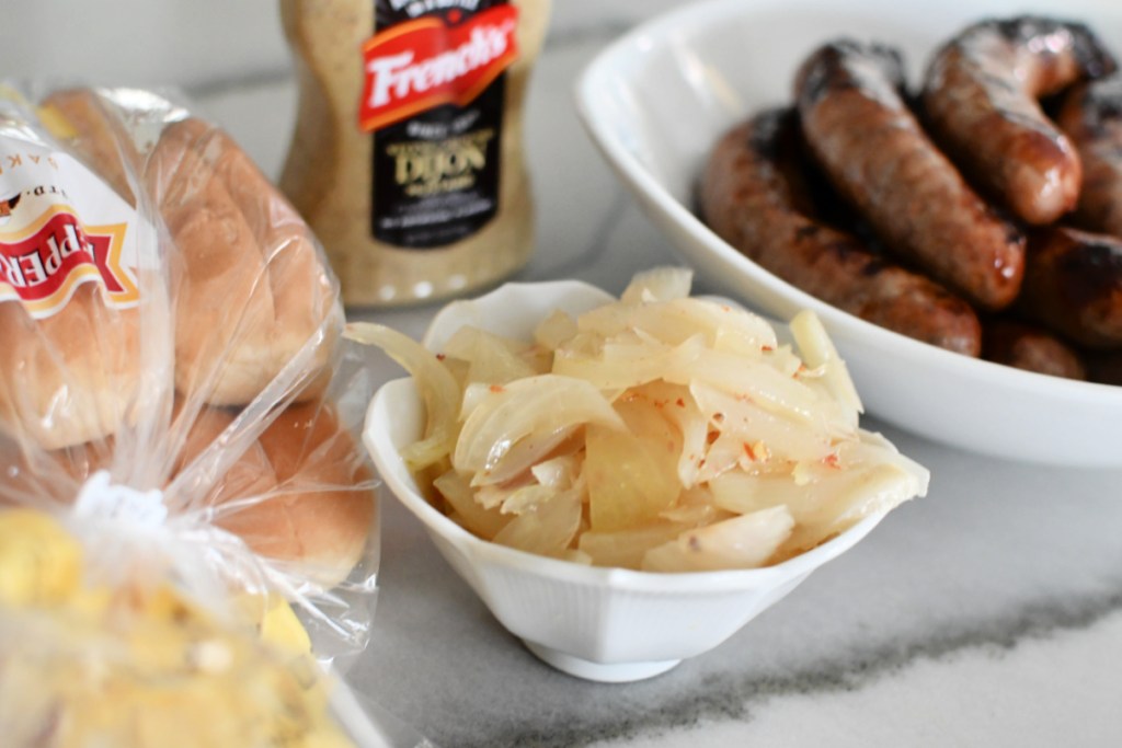 bowl of onions for brats on the grill