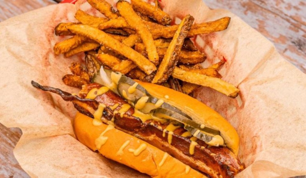 hot dog and fries on parchment paper