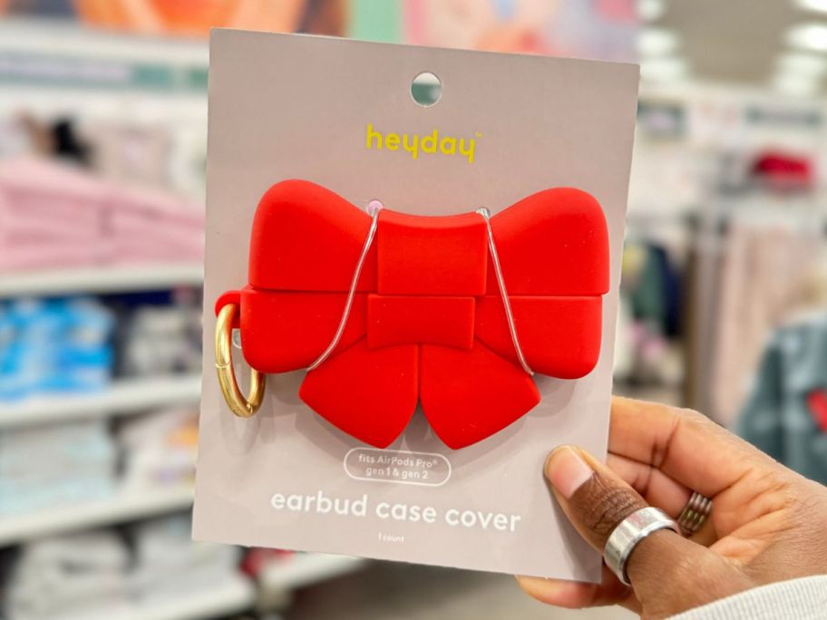 HeyDay Apple Airpods Case - Red Bow in hand in store