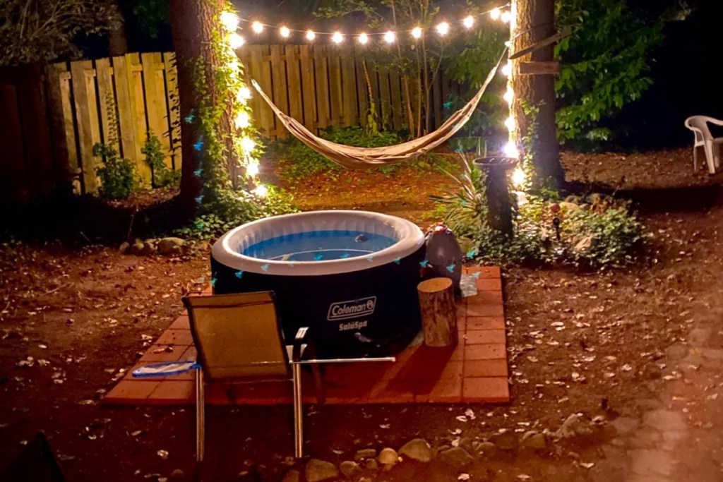 inflatable hot tub at night with string lights