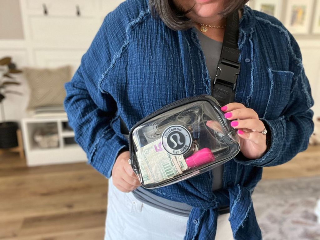 a woman wearing a lululemon clear belt bag over her chest