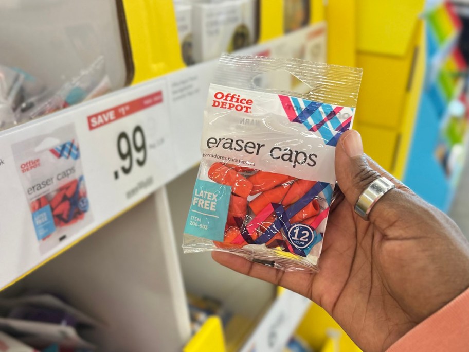 hand holding office depot eraser caps pack