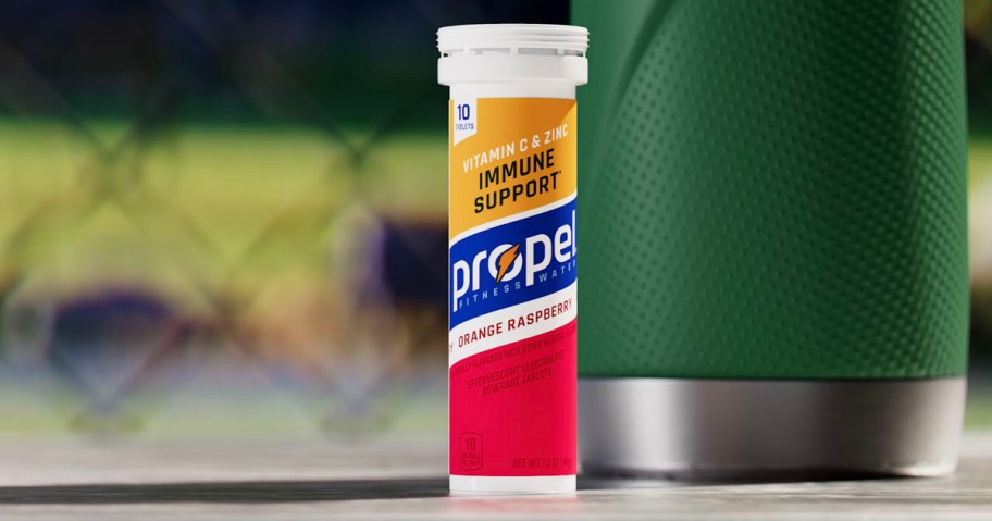 propel raspeberry bottle sitting on bench