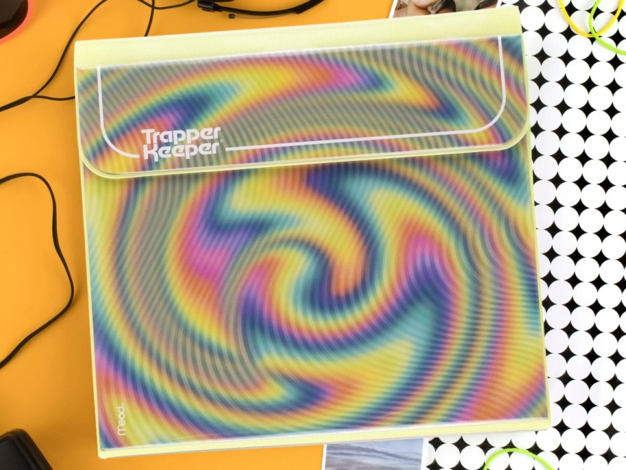 Trapper Keeper with yellow, blue, pink and green tie dye twist design