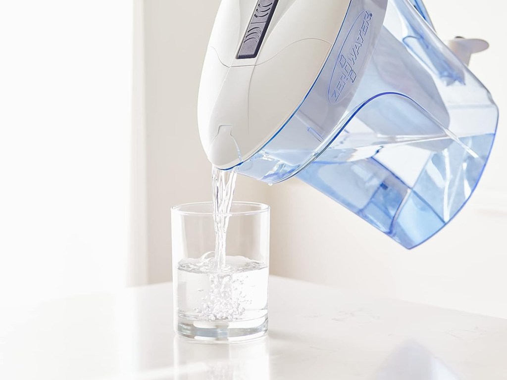 water pitcher pouring into cup