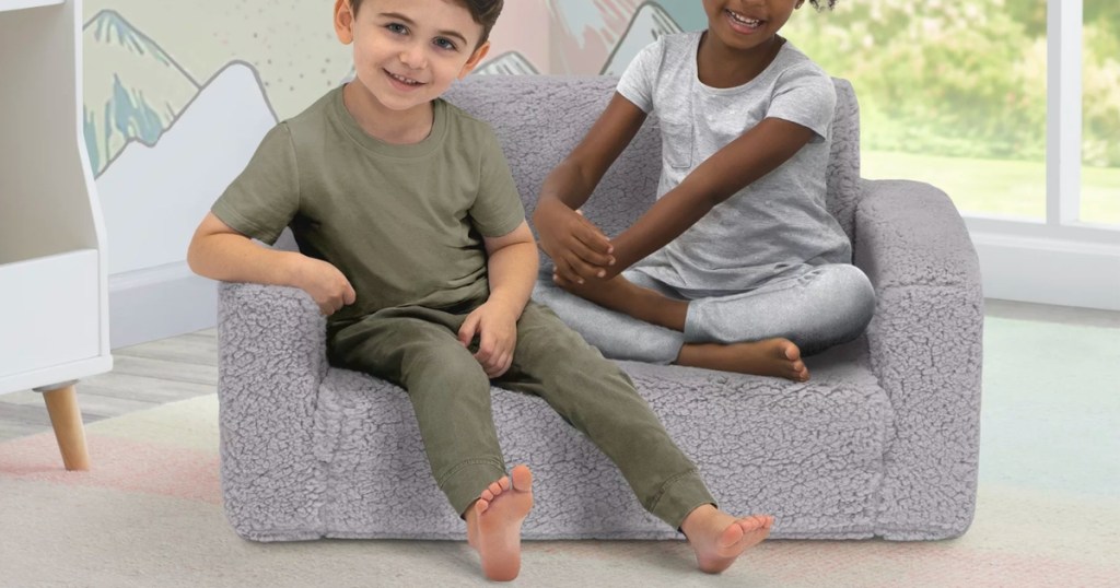 children sitting in Delta Children Kids Cozee Flip-Out Sherpa Flip Chair