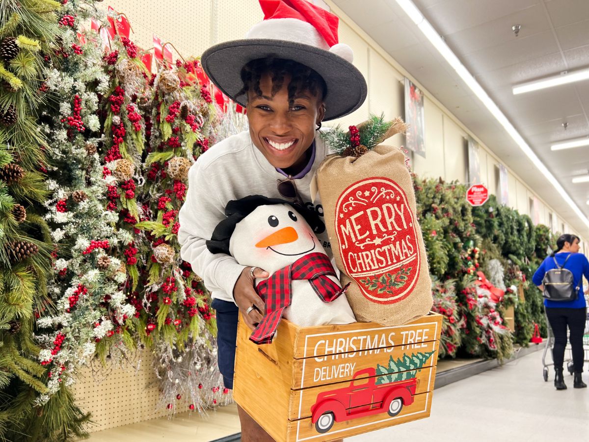 woman holding a crate full of Hobby Lobby Christmas decor