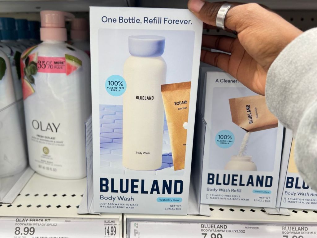 A hand Holding Blueland Body Wash 