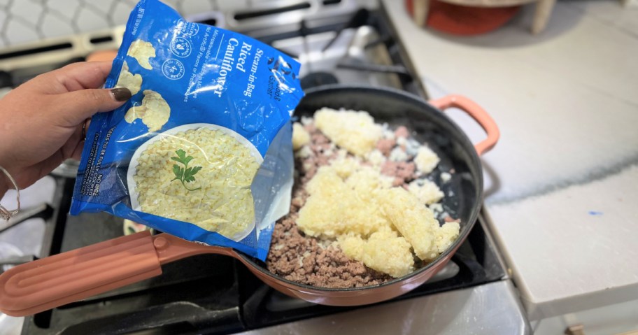 adding riced cauliflower to skillet