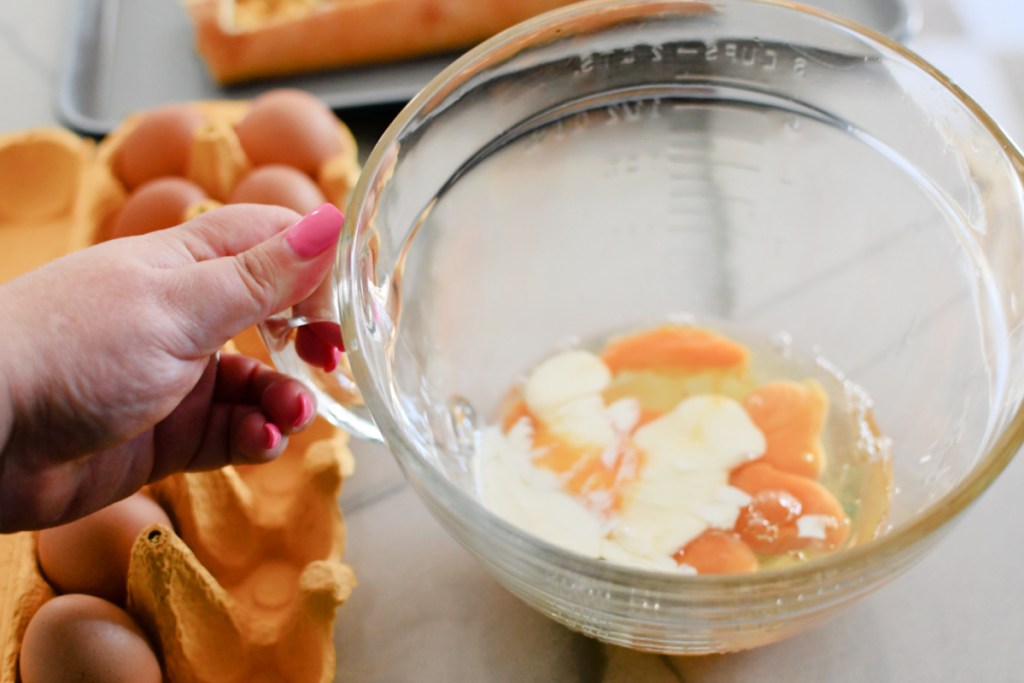 eggs and cream in a mixing bowl