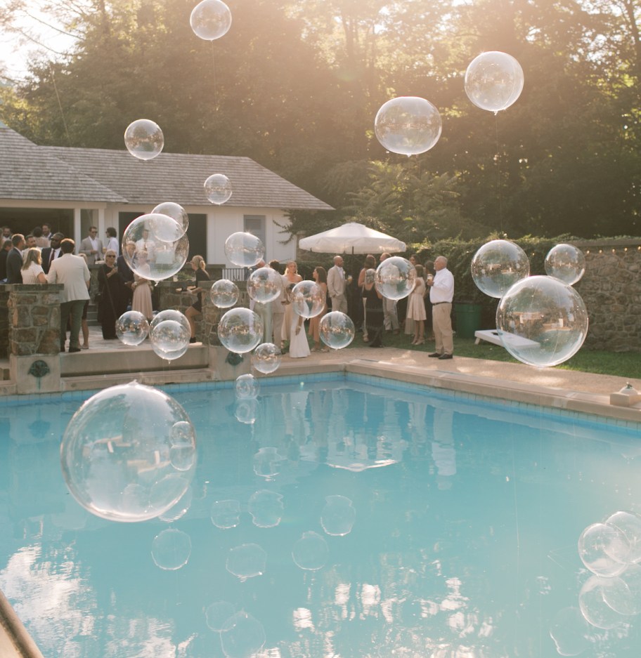 clear balloons in wedding pool