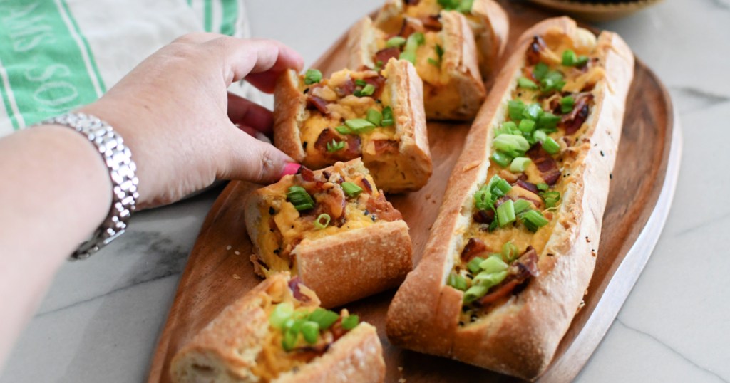 grabbing an egg boat from a wood tray