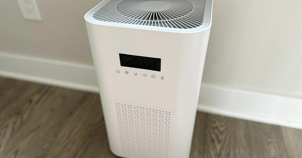 white air purifier next to wall