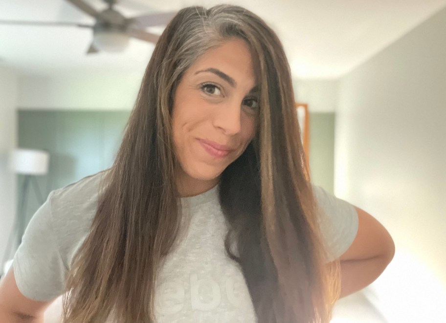 women with long brown hair smiling at camera