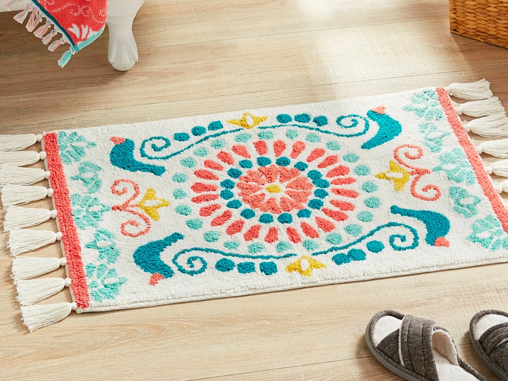 white medallion tassel rug on bathroom floor