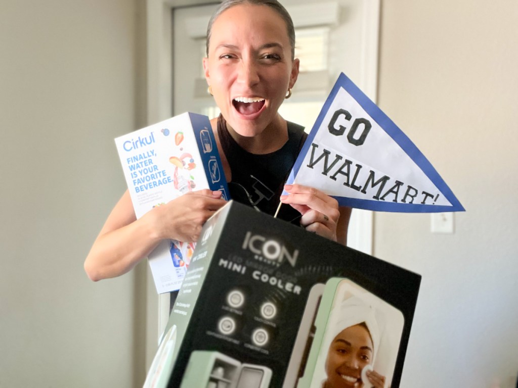 woman holding trending tiktok items and walmart penant flag