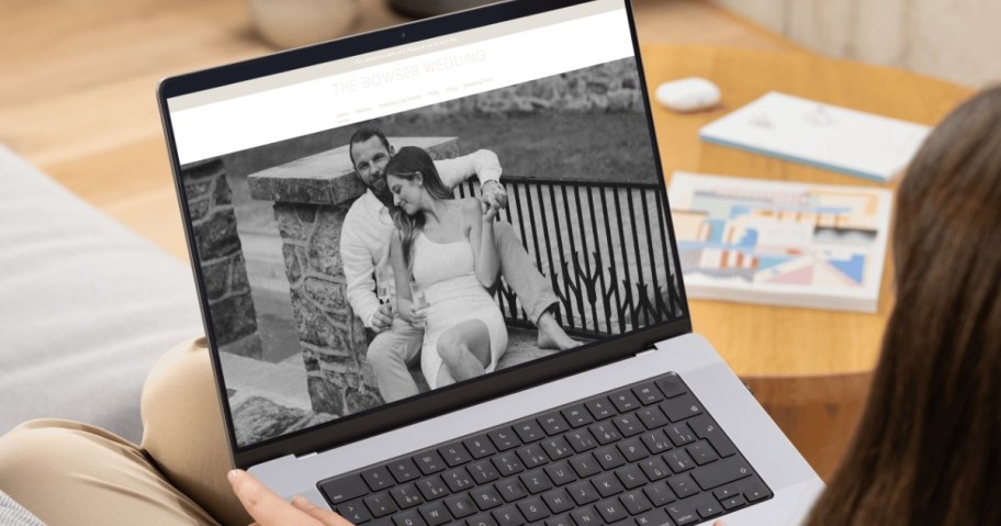 laptop with wedding website on screen