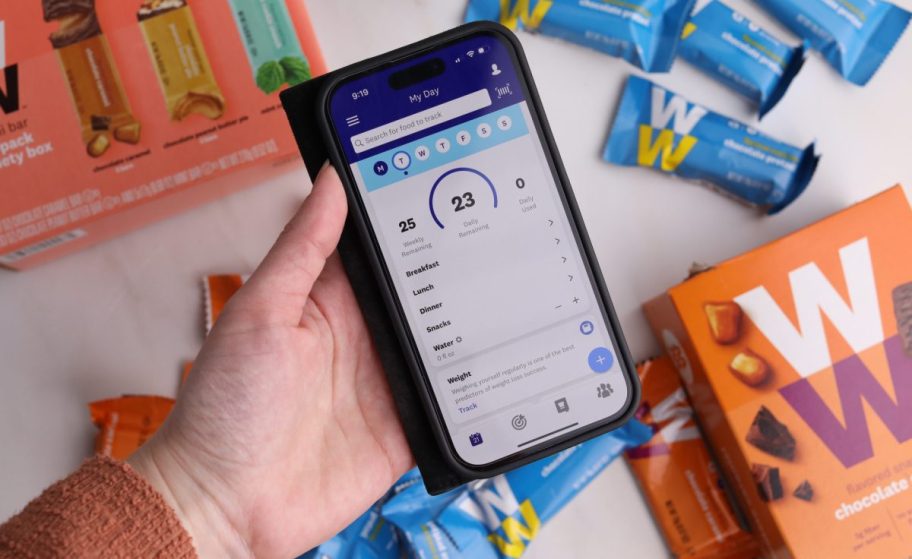 weightwatchers app on phone in hand