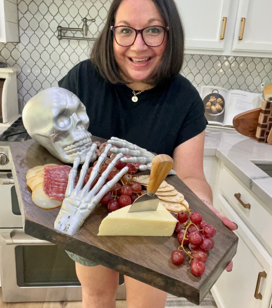 woman holding a DIY cutting board pottery barn tray