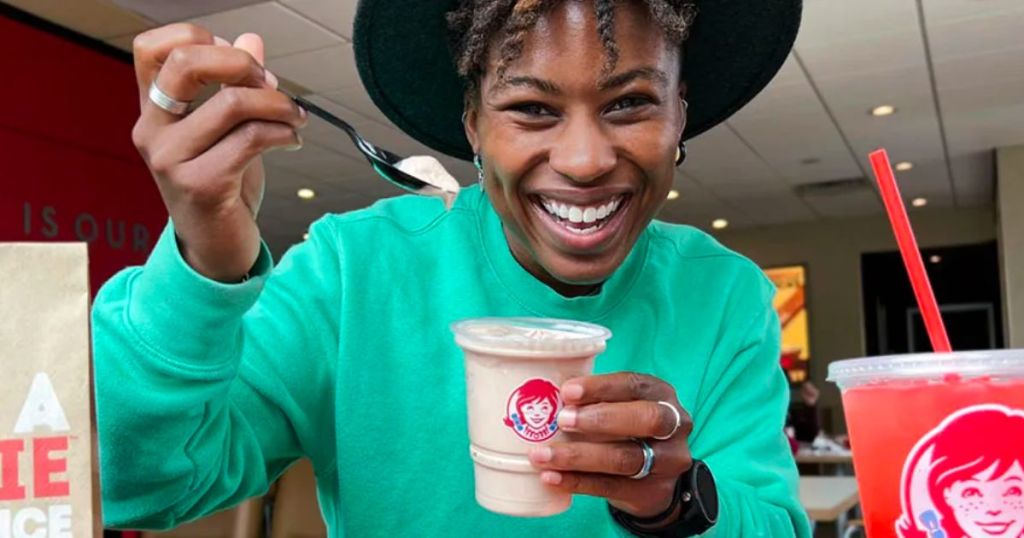 woman holding a wendy jr frosty