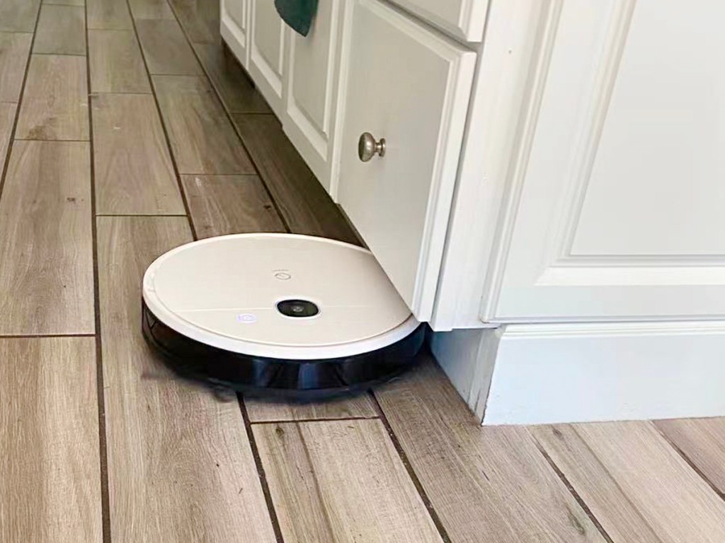 white yeedi robot vacuum cleaning hardwood floor 