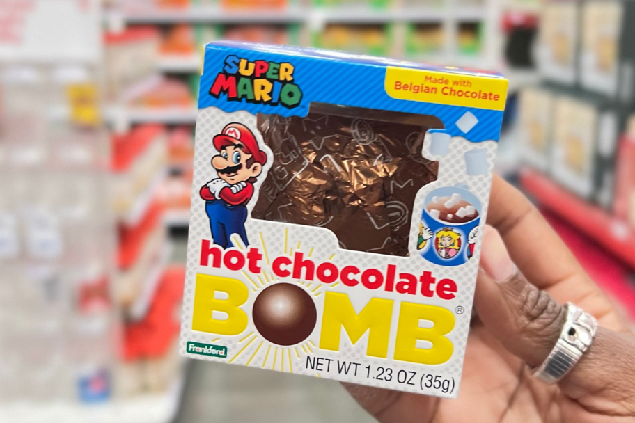 Hand holding Super Mario Brothers Hot Chocolate Bomb in Target