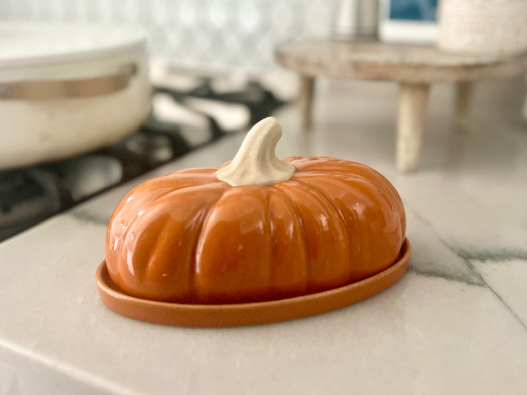 Celebrate Together Fall Harvest Ceramic Butter Dish displayed next to the stove